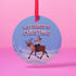 Round blue metal Christmas ornament featuring Glenn Danzig in sunglasses and Christmas lights riding reindeer through snowy landscape. Text reads "Last Caress of Christmas" in icy font.