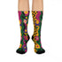 Colorful dopamine-infused crew socks with an all-over print featuring abstract flowers and leopard spots in bold hues of pink, purple, yellow, green, and black. Made of plush polyester-spandex blend, with black toe and heel accents. Designed to fit women’s US 5 to men’s US 12 shoe sizes.