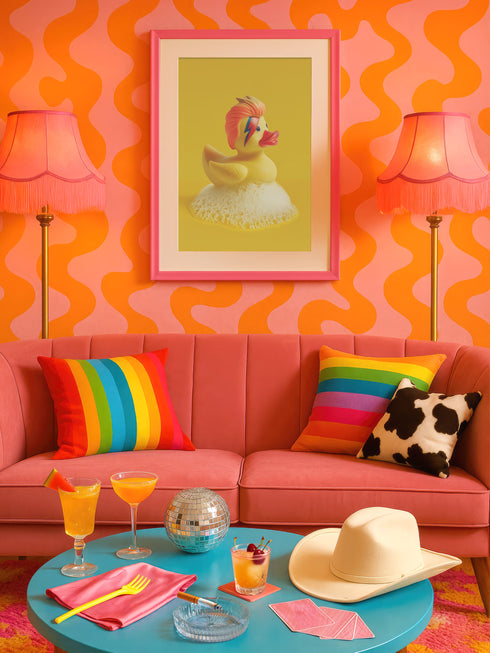 a living room with a pink couch and a blue coffee table