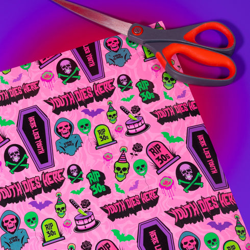 40th birthday Vibrant wrapping paper featuring a playful goth theme with illustrations of skulls, birthday cakes, and caskets marked "RIP 30s", set against a pink background with green accents. Ideal for themed 40th birthday gifts.