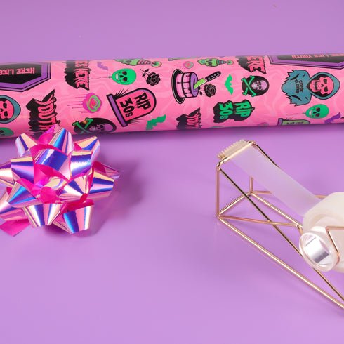 40th birthday Vibrant wrapping paper featuring a playful goth theme with illustrations of skulls, birthday cakes, and caskets marked "RIP 30s", set against a pink background with green accents. Ideal for themed 40th birthday gifts.
