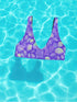 Bralette-style bikini top featuring a high neckline and vibrant jellyfish print in iridescent purples, blues, and greens on a lilac background. Made of recycled polyester and LYCRA XTRALIFE, this double-layered swim top includes removable padding, UPF 50+ protection, and is available in sizes XS to 3XL. Great for raves, beach days, and summer festivals.