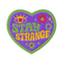 "A detailed embroidered patch in the shape of a purple heart with a vibrant green border. In a groovy, psychedelic font, the words "STAY STRANGE" are stitched in yellow and green. The design includes a mystical third eye at the top, and small retro flowers and stars, giving it a 70s hippie vibe.