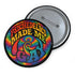 Round glossy pinback button measuring 2.25 inches featuring a vibrant rainbow psychedelic swirl with retro-style text that reads “Psychedelics Made Me Gay.” The background is a mix of rainbow waves and sparkles, with bold, colorful typography in orange, yellow, and blue. Made from durable tinplate with a safety pin backing, scratch-resistant mylar coating, and a high-gloss finish. Ideal for jackets, backpacks, or pride festival accessories.