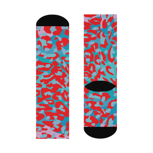 Dive into bold fashion with these vibrant socks featuring an eye-catching red, blue, and pink cheetah print pattern. Perfect for those who love to make a statement, these socks are ideal for brightening up any outfit and showcasing your unique style. Comfortable and stylish with black heels and toes, they are a must-have accessory for the fashion-forward.