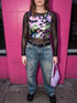 A close-up view of a sleeveless performance knit crop top featuring a vibrant pastel goth all-over print on a solid black background. The repeating pattern includes large black vampire bats flying over dripping, melted slime shapes in neon green. Wavy, warped checkerboard patterns in pastel pink, light purple, and black weave through the design. The graphic is finished with stylized, oversized pastel floral motifs and large open eyeballs staring outward.