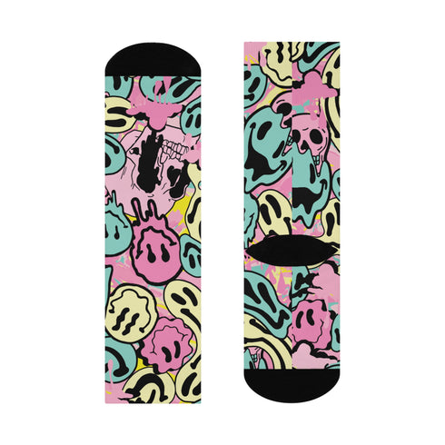 Fun and vibrant socks adorned with a 90s-inspired design of melting smiley faces in various colors, with black heels and toes, perfect for those who love retro and unique styles.