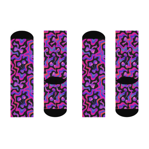 Coquette-style crew socks featuring a bold black background with hot pink and purple psychedelic squiggles, cherries, and shiny pink bows. Made of a soft polyester-spandex blend with reinforced black toe and heel. Fits US women's sizes 5–12 and men's up to 12. Stretchy, colorful, and cute for dopamine dressing.