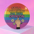 Round glossy pinback button measuring 2.25 inches with a bold rainbow pride flag background. Centered text reads “Still Not Asking For Your Opinion” in black, yellow, blue, and purple letters. Below the text is an illustrated hand with painted red nails giving the middle finger, surrounded by white daisies. The design is printed on tinplate with a scratch- and UV-resistant mylar coating. Button features a strong safety pin backing, perfect for bags, jackets, or pride outfits.