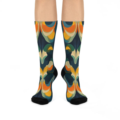Crew socks featuring a bold ‘70s-style abstract swirl pattern in deep green, orange, yellow, and navy blue.