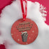 Round red metal Christmas ornament featuring angry possum in Santa hat emerging from trash can. Text reads "Have Yourself a Trashy Little Christmas" in dripping font with stars.