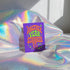 A purple greeting card with the text "Another Year Stranger" is displayed on a shiny, iridescent fabric surface.