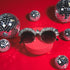 a pair of sunglasses sitting on top of a red box