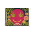 A rectangular doormat featuring a large hot pink smiley face on a deep teal background. The smiley face has green cannabis leaves for eyes and a yellow stitched-style smile. The central face is surrounded by stylized green foliage arches and concentric circles in pink, yellow, and white, resembling abstract flowers. The design mimics a vintage needlepoint or tapestry texture but is a flat print. The mat has a solid black trim border.