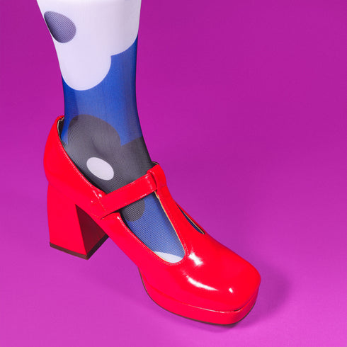 a pair of red and blue shoes with polka dots on them