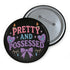 Glossy black pinback button with pastel-colored embroidered-style text that reads “Tell Me to Smile and I’ll Scream,” with lips icon and star accents.