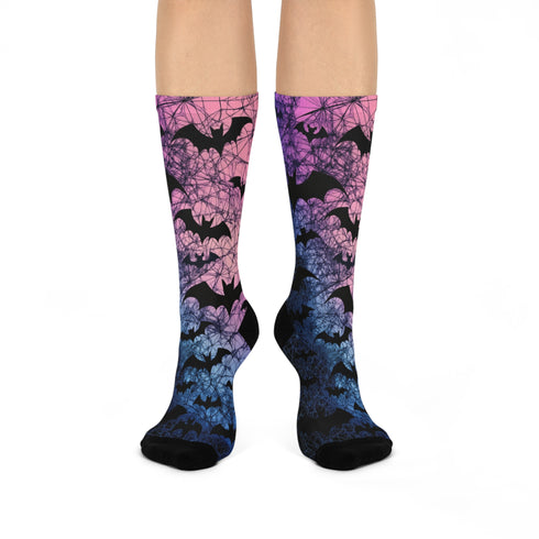 Black crew socks featuring an ombre pink-to-blue gradient with silhouetted bats and spiderweb details.