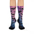 Black crew socks featuring an ombre pink-to-blue gradient with silhouetted bats and spiderweb details.