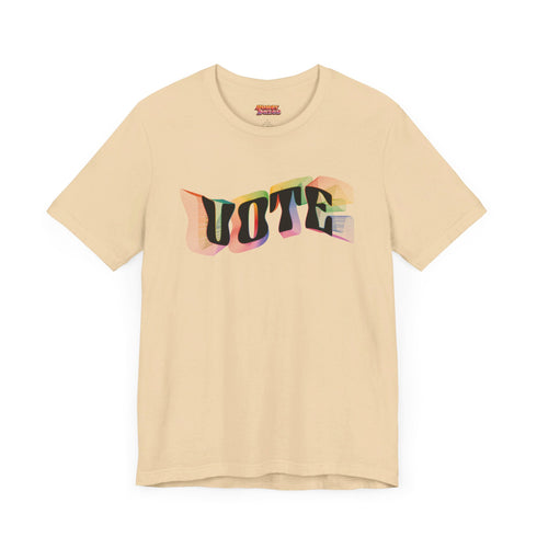 Election 2024 t-shirt with "VOTE" printed in large, colorful letters. Each letter features a different color from the rainbow spectrum, styled in a groovy 70s-inspired font.