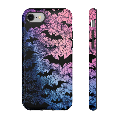 A pastel gothic phone case featuring black bat silhouettes over a gradient pink-to-blue ombré background with web-like detailing. Available for iPhone, Samsung, and Google Pixel models in matte or glossy finishes with dual-layer protection.