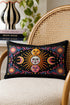 Rectangular 20x12 inch lumbar pillow cover in black featuring printed faux crewel embroidery of a large orange sunburst with a cream face, flanked by pink and yellow crescent moons, a golden moon face above and a pink moon face below, gold stars, blue dots, magenta and blue baroque scroll flourishes, and four corner medallions with golden flowers. Whimsigoth celestial design printed on both sides with a hidden zipper, crafted from soft linen look polyester.