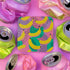 Square drink coaster featuring a playful banana print with bold yellow bananas over a pastel pink, purple, and green abstract background. Made of durable hardboard MDF with a cork backing and a glossy protective topcoat. Measures 3.74 by 3.74 inches, water-repellent and heat-resistant. Perfect for fruit-themed, retro, Y2K, coquette, or dopamine-core decor styles.