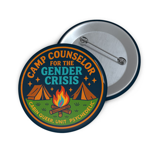 Round glossy pinback button measuring 2.25 inches featuring a playful camp-themed design with the phrase “Camp Counselor for the Gender Crisis.” The artwork includes two orange tents, a rainbow campfire, stars, and green grass. Bottom text reads “Cabin Queer, Unit Psychedelic.” Made from durable tinplate with a safety pin back and coated in a UV and scratch-resistant mylar finish. Bold and colorful, perfect for jackets, bags, or pride outfits.