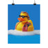 A quirky art print of a rubber duck styled after The Dude from The Big Lebowski, complete with a goatee, sunglasses, and plaid bathrobe. The duck lounges in bubbles, framed in a glossy red frame, with a manicured hand adjusting it against a monochromatic red backdrop.