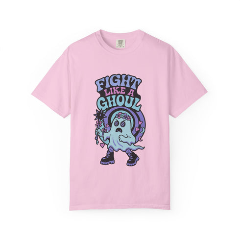 Unisex Comfort Colors 1717 t-shirt featuring a front print of a cute gothic ghost holding a mace wand with text reading "Fight Like A Ghoul." The ghost has floral details, combat boots, and pastel accents. Made of soft-washed, 100% ring-spun cotton with garment-dyed fabric and seamless tubular knit construction. Available in sizes S to 4XL.