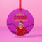 Round purple metal Christmas ornament featuring Drag Queen Divine in Santa hat and red dress with colored Christmas lights. Text reads "Have A Divine Christmas" in retro psychedelic lettering.