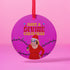 Round purple metal Christmas ornament featuring Drag Queen Divine in Santa hat and red dress with colored Christmas lights. Text reads "Have A Divine Christmas" in retro psychedelic lettering.