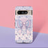 Coquette phone case featuring a pastel purple bow and pink floral lace background, dual-layer protection, UV protected, compatible with iPhone, Samsung Galaxy, and Google Pixel.