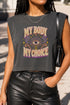 A garment dyed charcoal grey women's muscle tee featuring a slightly cropped boxy fit with structured shoulders and a wide rib collar. The front displays a retro 70s psychedelic graphic printed in purple, orange, and yellow. The text reads MY BODY MY CHOICE surrounding a central eye motif with a radial sunburst, framed by symmetrical mystical swirls and four point stars. The vintage style cotton shirt offers a faded aesthetic, presented on its own without background lifestyle elements.