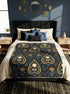 A rectangular velveteen minky blanket featuring a repeating dark academia pattern on a deep black background. The design includes gold and cream Ouija planchettes, each containing a blue all-seeing eye, a cream circle, and a light blue crescent moon framed by botanical leaves. Scattered between the planchettes are gold flowers with light blue stems, additional crescent moons, and small four-point stars. The reverse side of the blanket is made of a fluffy, textured off-white sherpa fleece.