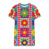 Short-sleeve crew-neck t-shirt dress falling to mid-thigh, with a bold retro patchwork floral all-over print. Large mod daisies in red, purple, yellow, and green sit across a sky blue background, with a central column framing single flowers on purple and pink tiles. Red and pink beaded borders run down the front, and green leaves and more flowers cover the sleeves. The relaxed pull-on dress has a flat printed surface in vivid, high-contrast color.