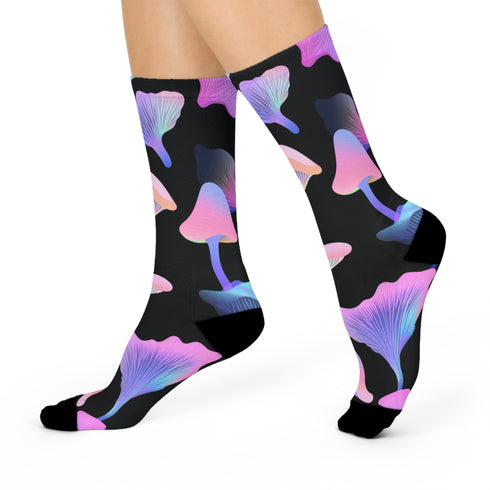 Black crew socks with an allover design of iridescent neon mushrooms in shades of pink, blue, and purple.