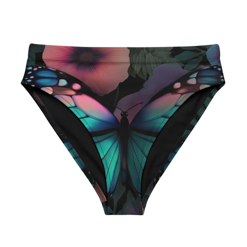 High-waisted bikini bottom with a gothic butterfly print in rich teal, plum, and midnight tones on a black background. Features kaleidoscopic wings forming a central butterfly motif across the front, with a flattering cheeky cut and double-layered fabric. Styled on a turquoise pool backdrop, this moody festival swimwear is perfect for soft goths, rave queens, and dark summer rebels.