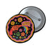 Round pinback button badge with a black background, featuring a retro illustration of a red revolver shooting out a rainbow flag that says “LOVE.” Surrounded by colorful 70s-style flowers and peace signs, outlined in wavy neon border. Glossy finish with vibrant pop colors and psychedelic design.