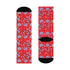 Fun and vibrant socks adorned with colorful roller skates, helmets, and wheels motifs on a red background, with black heels and toes, ideal for roller skating enthusiasts.