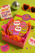 A close-up photograph of a glossy round ceramic coaster featuring a retro 70s psychedelic design. The artwork displays a cluster of six stylized cat face illustrations, each wearing a different pair of sunglasses including retro round and cat-eye shapes. The cats are colored in solid shades of white, hot pink, purple, and lime green. They are set against a vibrant background of wavy, swirling lines in bright orange, red, and purple. The top surface has a highly reflective clear glaze.