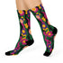 Colorful dopamine-infused crew socks with an all-over print featuring abstract flowers and leopard spots in bold hues of pink, purple, yellow, green, and black. Made of plush polyester-spandex blend, with black toe and heel accents. Designed to fit women’s US 5 to men’s US 12 shoe sizes.