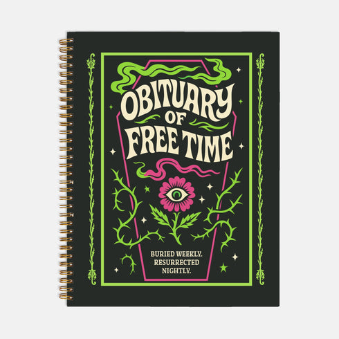A black hardcover spiral planner shown flat on a plain background. The cover features a vibrant, coffin-shaped frame in lime green and magenta pink, bordered by thorny vines. Inside the frame, the title "Obituary of Free Time" is written in a psychedelic 70s-style font. Below the title, a pink flower with a single green eyeball at its center blooms from a thorny stem. The planner is bound with a gold metal wire-o spiral on the left side. The design has a spooky cute, gothic floral aesthetic.