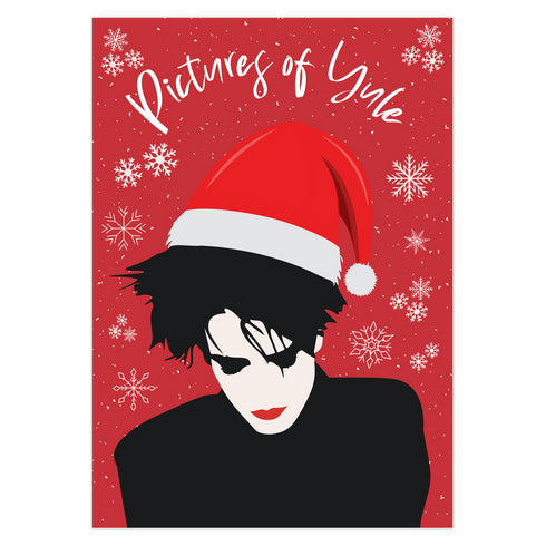 A festive greeting card featuring an illustration of Robert Smith from The Cure, wearing a Santa hat. The card has a red background with white snowflakes and the text "Pictures of Yule" at the top, playfully referencing the song "Pictures of You." The card merges gothic and holiday themes for a unique seasonal twist.