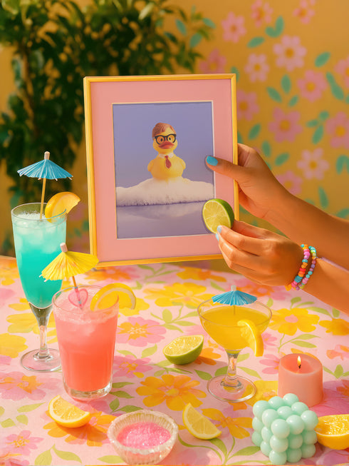 a person holding up a picture of a person in a pool