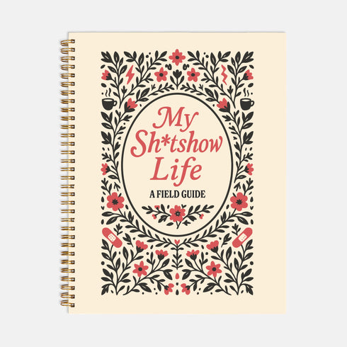 An 8.5 x 11 inch hardcover spiral-bound planner with a cream-colored cover featuring red and black folk art style floral illustrations. The cover reads "My Sh*tshow Life: A Field Guide" in a retro serif font. The planner has a durable satin matte laminated cover adhered to chipboard and a metal wire-o spiral binding available in gold or black. Interior pages are undated and include monthly and weekly layouts with sections for notes, to-do lists.