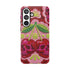 Dual layer matte phone case with a high fidelity 2D print that creates a hyper realistic faux crochet and knit illusion. The central design shows two conjoined cherries styled as bright pink and burgundy human skulls with lime green stems and leaves. The background is a detailed scalloped lace doily pattern in hot pink, deep red, and lime green. Matte finish shell with a black inner TPU lining, precise camera cutout, and open ports. Pastel goth macabre alt fashion phone accessory, made to order.
