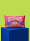 A bright magenta pink rectangular lumbar pillow cover featuring a flat 2D printed faux embroidery design. The printed illusion shows light pink bubble text reading NO THOUGHTS JUST BLANKETS. Below the text is a cartoon pink brain with a happy face, tucked into a blue bed with blue pillows. The brain is covered by a textured-looking orange blanket decorated with light purple daisies. The entire design is a smooth printed trompe l'oeil stitch effect, not real woven or stitched texture.