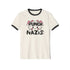 Off-white ringer t-shirt with black contrast trim on the collar and sleeve cuffs. The front features a bold, kawaii-inspired graphic of a cute cat with pink bows, blushing cheeks, and an assertive expression. Above the cat, the phrase "PUNCH" is written in bold, black capital letters, while below, "NAZIS" is displayed in a matching bold font. The cat’s paws are raised, playfully flipping off the viewer, adding a rebellious edge to the design. The t-shirt has a vintage-inspired fit, made from soft cotton fab