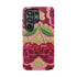 Dual layer matte phone case with a high fidelity 2D print that creates a hyper realistic faux crochet and knit illusion. The central design shows two conjoined cherries styled as bright pink and burgundy human skulls with lime green stems and leaves. The background is a detailed scalloped lace doily pattern in hot pink, deep red, and lime green. Matte finish shell with a black inner TPU lining, precise camera cutout, and open ports. Pastel goth macabre alt fashion phone accessory, made to order.