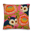 A square linen-feel throw pillow with a vibrant, maximalist print on a bright pink background. The pattern features two large, illustrated possums (or sugar gliders). The animals are nestled amongst large, 70s-style retro floral designs in shades of orange, marigold yellow, and turquoise, with avocado green leaves. The pillow has a textured, woven appearance, mimicking a high-end linen fabric. The double-sided print is colorful, eclectic, and groovy, with a distinct vintage 70s folk art feel.